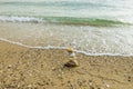 Beautiful view of waves oncoming on composition of stones.