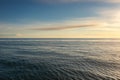 Beautiful view of the wavy ocean gleaming under the cloudy blue sky - great for wallpapers Royalty Free Stock Photo