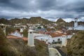 Beautiful view of white houses with brick roofs in Guadix, Spain on a cloudy day Royalty Free Stock Photo