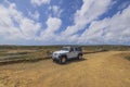 Beautiful view of white jeep wrangler in desert on road of National park,