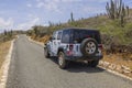 Beautiful view of white jeep wrangler on road of National park, Aruba. Oranjestad.