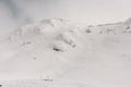 beautiful white snow-covered mountain with traces of skis on it