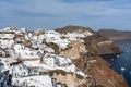 Beautiful view of whitewashed buildings and the coast in Oia, Santorini, Greece. Royalty Free Stock Photo