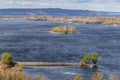 Beautiful view of the wide river with the sunlit islands before the storm. Thunder Sky. Dnieper River from a height, Ukraine.