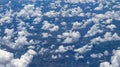 Beautiful view from window of plane flying over clouds. Natural panorama with clouds. Royalty Free Stock Photo