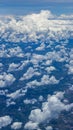 Beautiful view from window of plane flying over clouds. Natural panorama with clouds. Royalty Free Stock Photo