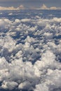 Beautiful view from window of plane flying over clouds. Natural panorama with clouds. Royalty Free Stock Photo