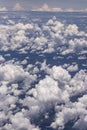 Beautiful view from window of plane flying over clouds. Natural panorama with clouds. Royalty Free Stock Photo