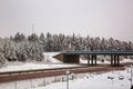 Beautiful view of winter landscape. Highway and small bridge view on a winter day Royalty Free Stock Photo