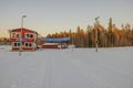 Beautiful view of winter landscape with ski tracks and building of ski sports club.