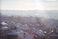 Beautiful view of winter morning fog, snow and sun filling on landscape of houses and buildings in Belgrade. Royalty Free Stock Photo