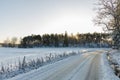 Beautiful view of winter scape. Country road in snow forest. Royalty Free Stock Photo