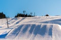 Beautiful view of the winter ski slope with a lot of snow and sk Royalty Free Stock Photo