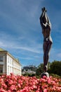 Beautiful view of women statue in famous Mirabell Gardens, Austria, Europe under blue sky