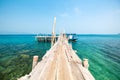 Seascape with pier and small fishing boat. Royalty Free Stock Photo