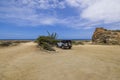 Beautiful view of Wrangler SUV in parking lot of Arikok National Park on against Caribbean Sea.