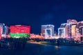 Beautiful views of illuminated buildings, with multicolored illumination, at night.