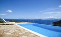 Beautiful views of the infinity pool by the sea Royalty Free Stock Photo