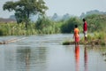 Beautiful views of nature on the banks of a river in West Bengal where some village boys are playing