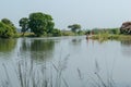 Beautiful views of nature on the banks of a river in West Bengal where some village boys are playing