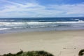 Beautiful views of the oregon coast with it`s vast sandy beaches and endless sandy dunes, on a sunny blue sky day Royalty Free Stock Photo