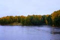 Beautiful views of the River flows through the autumn forest. Royalty Free Stock Photo