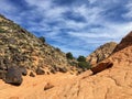 Views of sandstone and lava rock mountains and desert plants around the Red Cliffs National Conservation Area on the Yellow Knolls Royalty Free Stock Photo