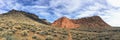 Views of sandstone and lava rock mountains and desert plants around the Red Cliffs National Conservation Area on the Yellow Knolls Royalty Free Stock Photo