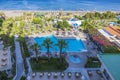 Beautiful views of territory hotel with outdoor pool and Mediterranean sea.