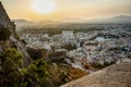 Beautiful viewview of the cityscape of Alicante City with Santa Barbara Castle under sunset sky