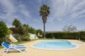 Beautiful villa with a healthy garden and pool Royalty Free Stock Photo