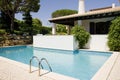 Beautiful villa with a healthy garden and pool Royalty Free Stock Photo