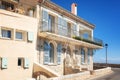 Beautiful villa with two statues of lions in front of the entrance along the promenade Amiral de Grasse in Antibes