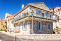 Beautiful villa with two statues of lions in front of the entrance along the promenade Amiral de Grasse in Antibes