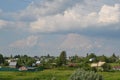 Beautiful village in a field on a quiet Sunny summer day blue sky Royalty Free Stock Photo