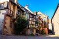 Beautiful village Riquewihr with historic buildings and colorful houses in Alsace of France - Famous vine route Royalty Free Stock Photo