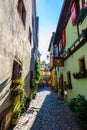 Beautiful village Riquewihr with historic buildings and colorful houses in Alsace of France - Famous vine route Royalty Free Stock Photo