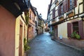 Beautiful village Riquewihr with historic buildings and colorful houses in Alsace of France - Famous vine route. Royalty Free Stock Photo