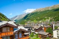 Beautiful village Zermatt in Swiss Alps with its typical chalets photographed in summer. Mountains in background. Alpine landscape Royalty Free Stock Photo