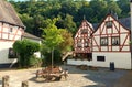 Beautiful villages: Half timbered houses and a bench inMonreal in rhineland-palatinate Royalty Free Stock Photo