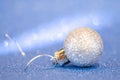 Beautiful vintage Christmas ball toy close-up on a blue background of sparkles Royalty Free Stock Photo