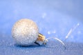 Beautiful vintage Christmas ball toy close-up on a blue background of sparkles Royalty Free Stock Photo