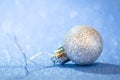 Beautiful vintage Christmas ball toy close-up on a blue background of sparkles Royalty Free Stock Photo