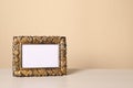 Beautiful vintage empty frame on white wooden table, space for text Royalty Free Stock Photo