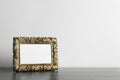 Beautiful vintage empty frame on wooden table, space for text Royalty Free Stock Photo