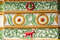 Beautiful vintage exterior. Colorful stucco red goat, green vine
