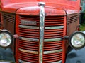 Camden, NSW, Australia - 15 Jan 24: Old red Bedford farming truck with beautiful retro features of a grille and headlamps.