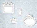 Beautiful vintage frames with Cupids on tender blue damask background Royalty Free Stock Photo