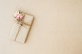 Beautiful vintage gift box wrapped in brown craft paper for holiday, anniversary, and festive events concept. Flat lay top view