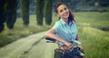 Beautiful vintage girl sitting next to bike, summer time Royalty Free Stock Photo